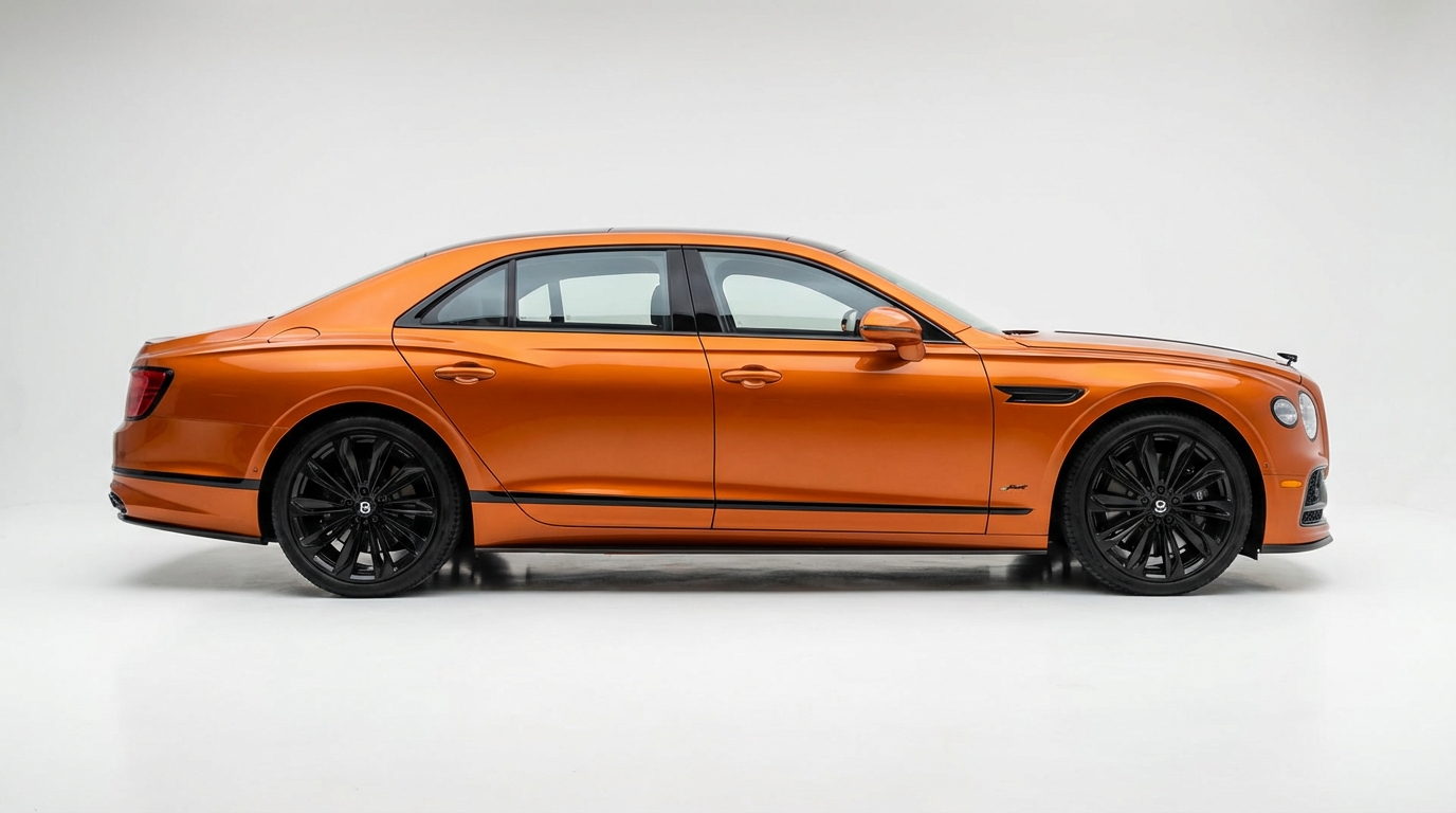 Orange Bentley Flying Spur Mulliner on a studio background after AI background removal